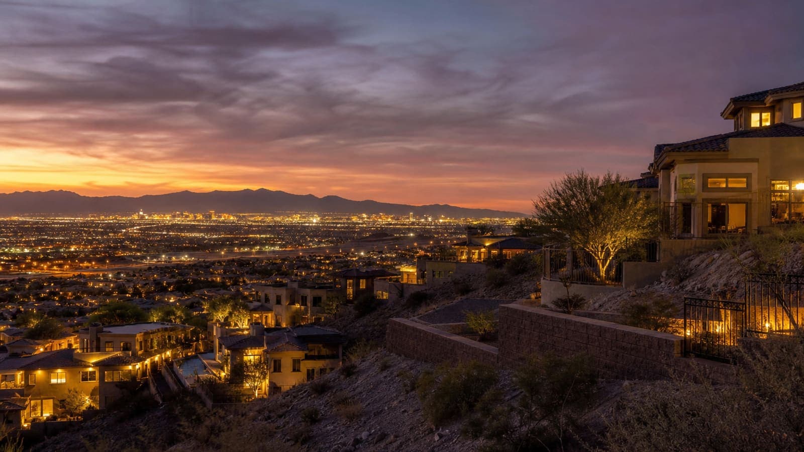 Hillside Henderson homes overlooking the Las Vegas valley at dusk